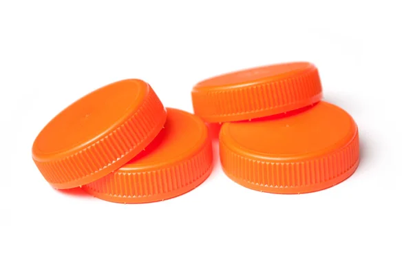 Крупный План Оранжевых Пластиковых Пробок Переработки Белом Фоне — стоковое фото