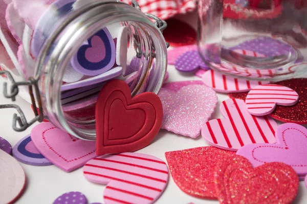 Closeup Pink Red Hearts Falling Glass Container White Background Valentine — Stock Photo, Image