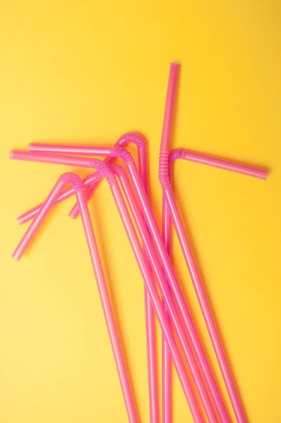 Closeup Pink Plastic Straw Collection Yellow Background — Stock Photo, Image