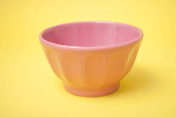 Closeup Pink Ceramic Bowl Yellow Background — ストック写真