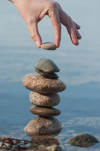 Closeup Man Putting Pebble Stone Balance Water Lake Reflection — Stock Photo, Image