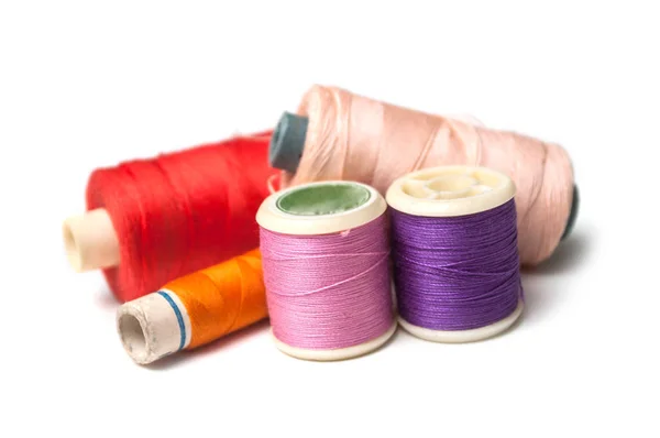 Closeup of sewing thread spool bobbins on white background — Stock Photo, Image