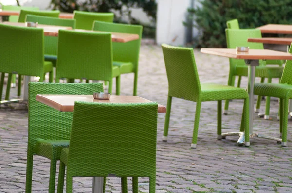 Closeup of green chairs at the terrace of the restaurant in the — Stock Photo, Image