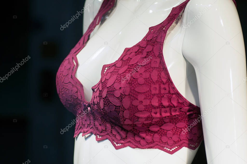 closeup of red bra on mannequin in fashion store showroom 