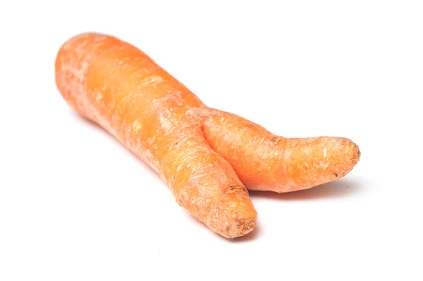 Closeup of deformed carrot on white background — Stock Photo, Image