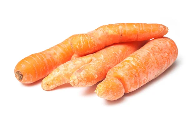 Closeup of deformed carrots on white background — Stock Photo, Image