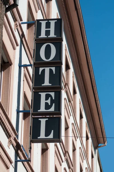 Closeup of hotel signage on building facade — Stock Photo, Image