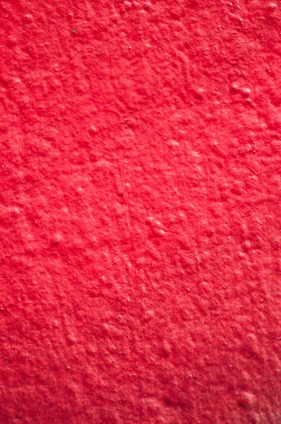 Duvar dokusunda kırmızı boyama yakın çekim — Stok fotoğraf