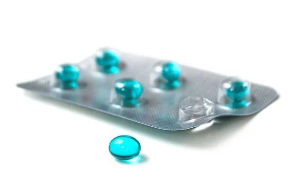 Closeup of blue pills on white background — Stock Photo, Image