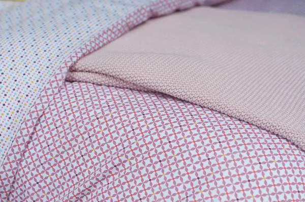 closeup of pink bed linen set in decoration store showroom