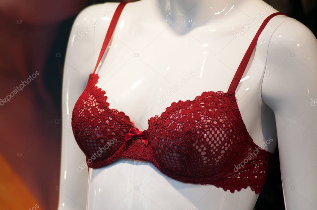 closeup of red bra on mannequin in fashion store showroom 