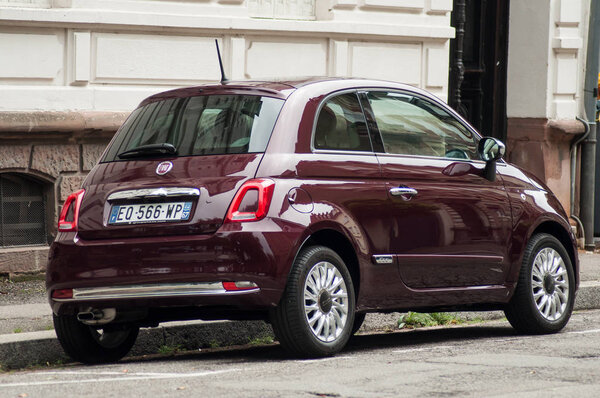 Closeup of purple Fiat 500 parked in the street