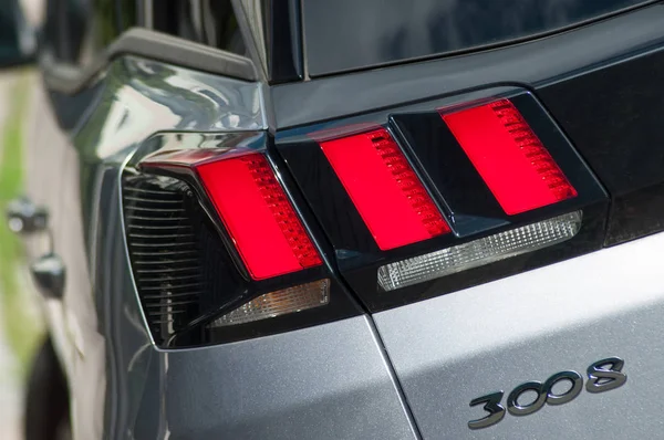 Closeup of rear lights of grey Peugeot 3008 crossover parked in the street — Stock Photo, Image