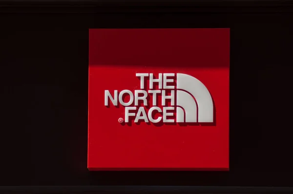 Closeup of the north face logo on store front in the street — Stock Photo, Image