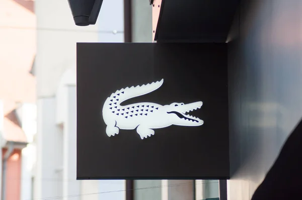 Lacoste sign on store front, Lacoste is the famous french chain of luxury polo — Stock Photo, Image