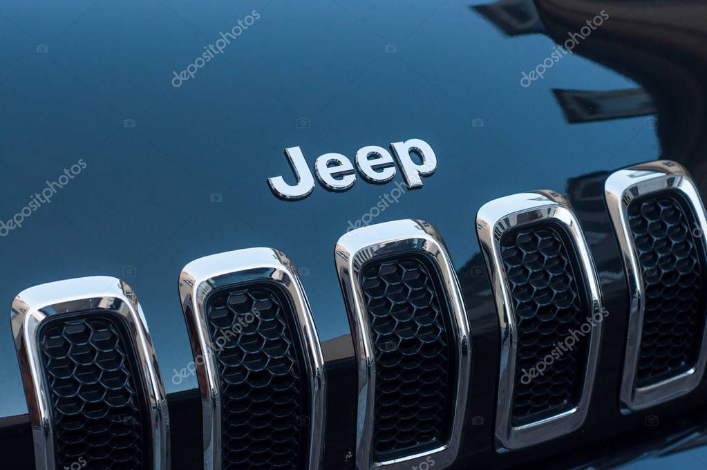 Mulhouse - France - 4 September 2019 - Closeup of Jeep logo on black car front parked in the street