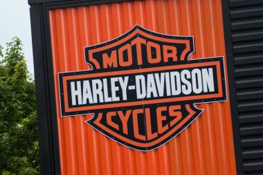 Closeup of Harley Davidson sign on retailer facade clipart