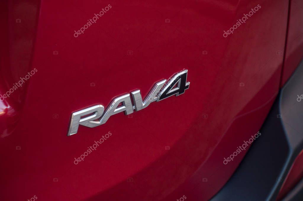 Mulhouse - France - 11 September 2019 - Closeup of Toyota rav4 logo on red car parked in the street