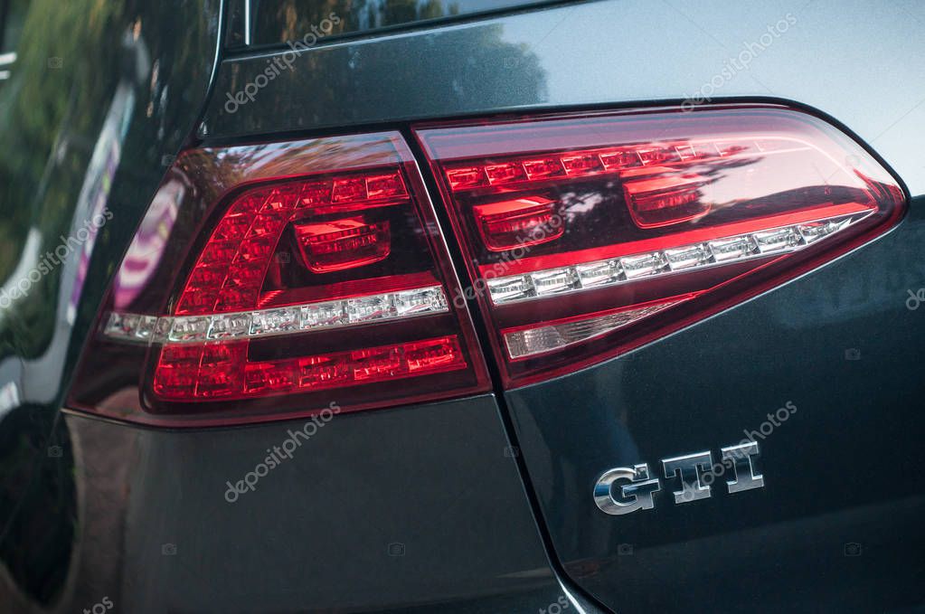 Mulhouse - France - 11 September 2019 - Closeup of rear lilght and sign on grey Volkswagen Golf GTI parked in the street