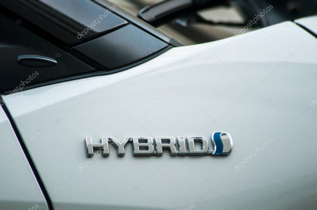Mulhouse - France - 11 September 2019 - Closeup of Hybrid sign on toyota car parked in the street