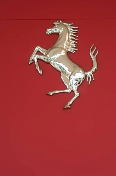 Ferrari logo on red wall in ferrari retailer showroom — Stock Photo, Image