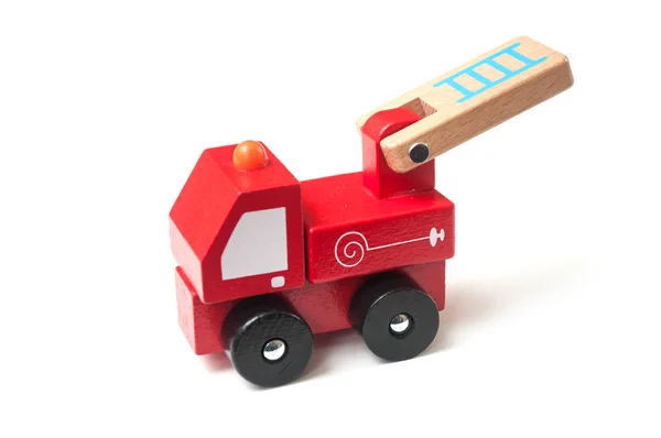 Closeup of miniature toy, wooden fire truck on white background — Stock Photo, Image