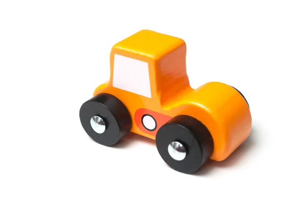 Closeup of miniature toy, wooden orange color car — Stock Photo, Image