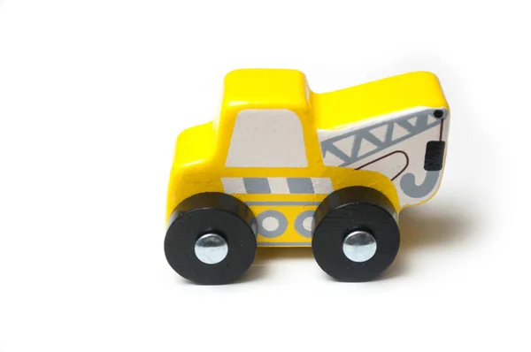 Closeup of miniature toy, wooden yellow tow truck — Stock Photo, Image