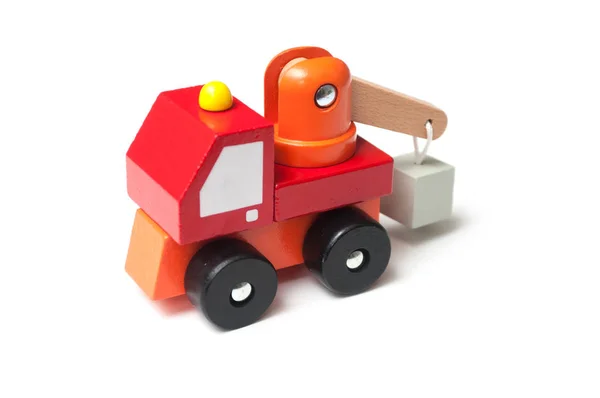 Closeup of miniature toy, wooden red truck with carrycot on whit — Stock Photo, Image