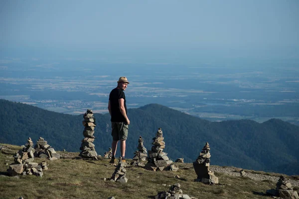 Portrait Man Standing Top Mountain Many Stones Balance Floor Looking — Stock Photo, Image