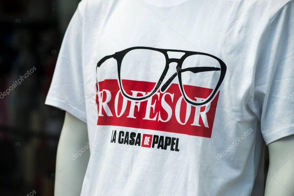 Mulhouse - France - 23 August 2020 - Closeup of la casa de papel logo on  on white tee shirt for men in a fashion store showroom