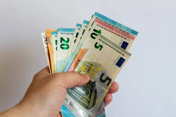 Bunt Euro Händerna Vit Bakgrund Eurosedlar Vit Bakgrund — Stockfoto