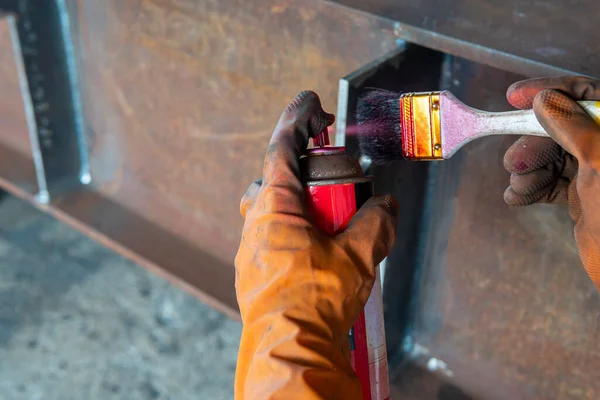 The step two of doing penetrant testing is step to use spray Liquid Penetrant into the brush before apply to the welded for Non-Destructive Testing(NDT) with process Penetrant Testing(PT).