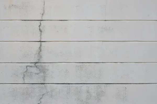 Old white wall background with cracked mark, copy space
