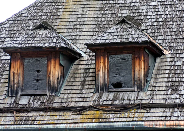 Traditional shingle roof cladding with two dormer roof windows.Unfinished roof.