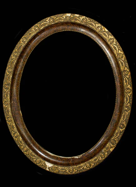 Old oval wooden picture frame isolated on black background.