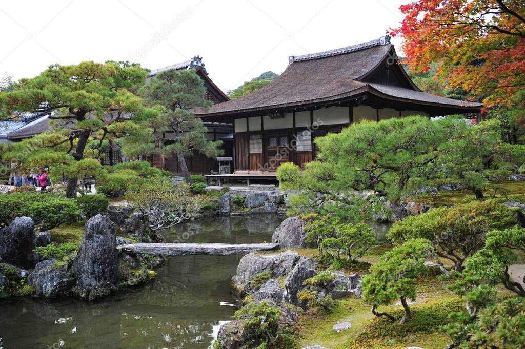 Breathtaking view on old traditional temple in japan garden during autumn season. High quality photo