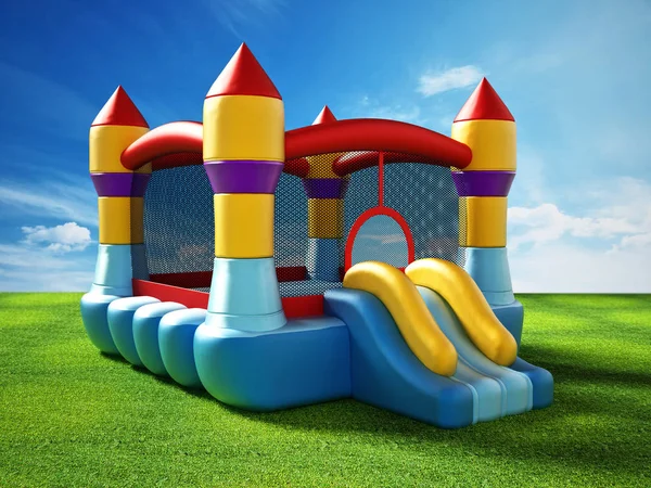 Bounce house standing on green grass. 3D illustration — Stock Photo, Image