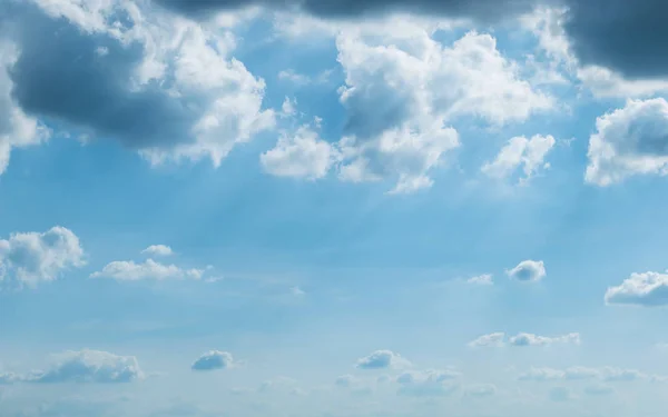 sunlight through cloud on blue sky