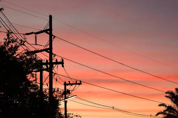 Pylon electricity power line with sunset sky background — Stock Photo, Image