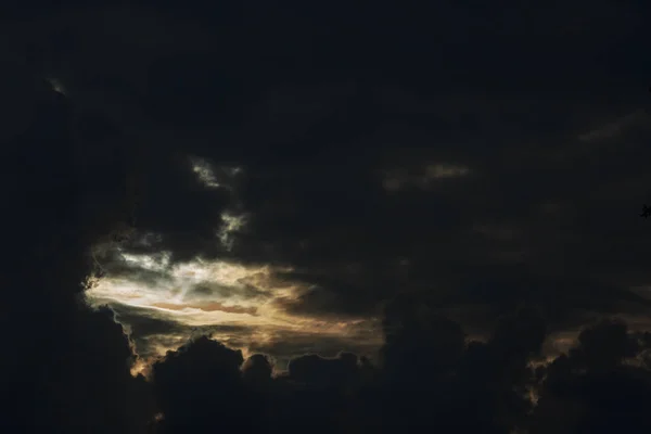 Heaven light in dramatic sky with dark cloud — Stock Photo, Image