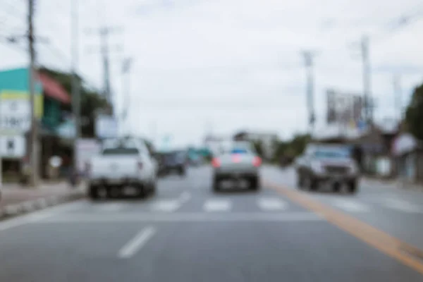 Image blur car driving on urban road — Stock Photo, Image