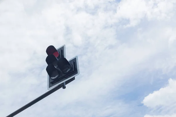 red traffic light on crossroad