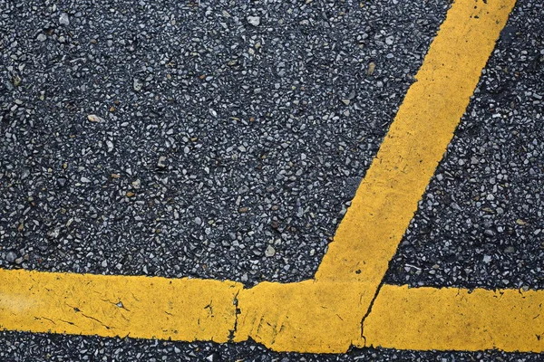 Yellow line marking on black asphalt road — Stock Photo, Image