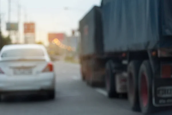 Truck driving on urban road, image blur background — Stock Photo, Image