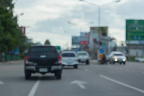 Image blur car driving on urban road — Stock Photo, Image