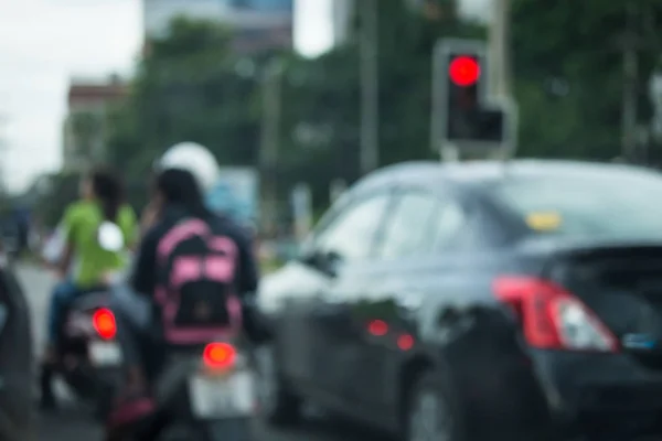 Car driving on urban road, image blur background — Stock Photo, Image