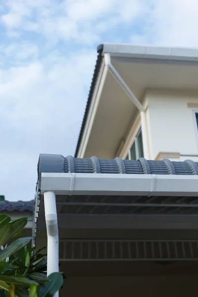 roof gutter on residential house building