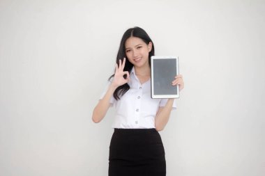 Portrait of thai adult student university uniform beautiful girl show her tablet.