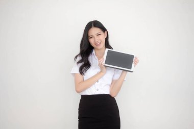 Portrait of thai adult student university uniform beautiful girl show her tablet.
